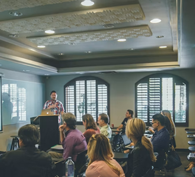 Speaker addressing an audience at a gene therapy conference session